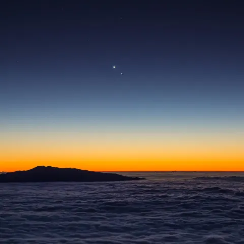 a sunset over a body of water