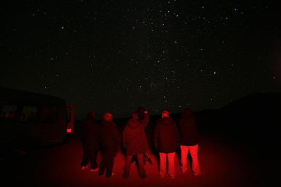 a group of people in a dark sky