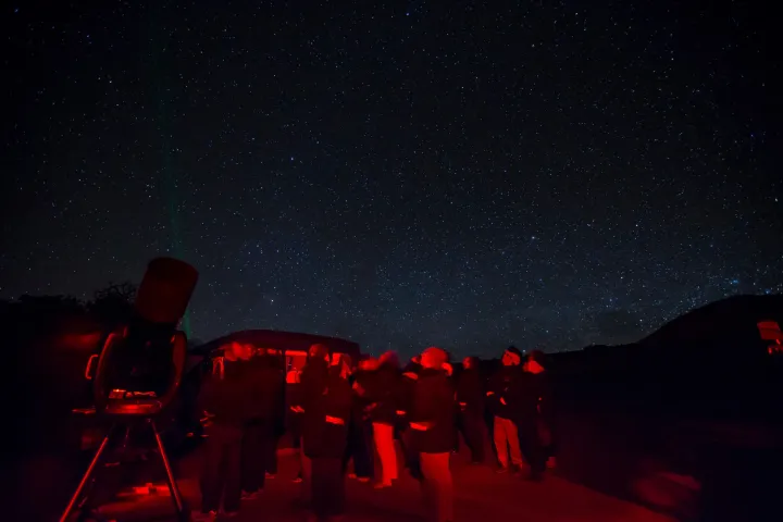 a group of people in a dark room