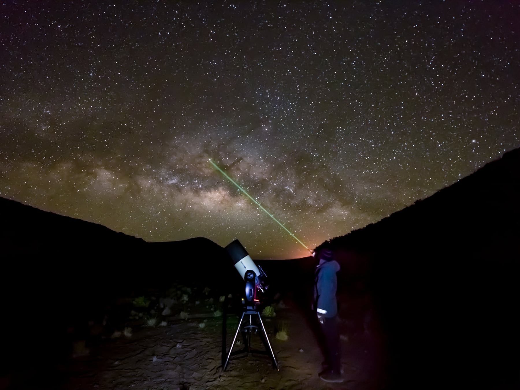 a man in a dark sky